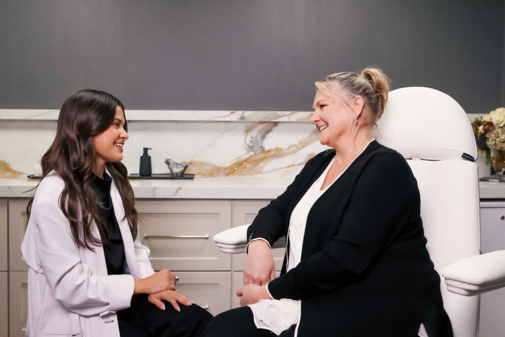 A female patient and a Look Lab provider share a laugh and a smile during the patient's consultation. It's this kind of welcoming, compassionate partnership that leads to right treatment plan—including one that has the best hydrafacial in Winter Park.